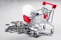 Shopping Cart with Bulbs and Coins Royalty Free Stock Photo