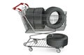 Shopping cart with car tires Royalty Free Stock Photo