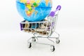 Shopping cart with coins for retail business. Image use for online and offline shopping, marketing place world wide, business