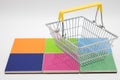 shopping cart on colored pads Royalty Free Stock Photo