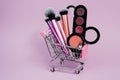 Shopping cart with cosmetics. Online sales concept