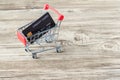 Shopping cart with credit card. Stay home shopping and electronic payment with credit card concept. Small shopping cart with credi Royalty Free Stock Photo