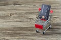 Shopping cart with credit card. Stay home shopping and electronic payment with credit card concept. Small shopping cart with credi Royalty Free Stock Photo