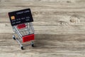 Shopping cart with credit card. Stay home shopping and electronic payment with credit card concept. Small shopping cart with credi Royalty Free Stock Photo