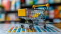 Shopping cart with data charts for optimizing marketing and sales strategies. Concept E-commerce