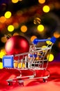 Shopping cart with decorative ball Royalty Free Stock Photo