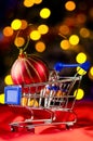 Shopping cart with decorative ball Royalty Free Stock Photo