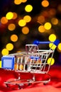 Shopping cart with decorative ball Royalty Free Stock Photo