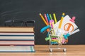 shopping cart filled with back to school supplies with study glasses