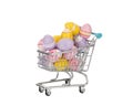 Shopping cart filled with colored Easter eggs. Royalty Free Stock Photo