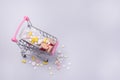 Shopping Cart Filled with Pills Blue Background Concept Set of Medicines in the Store. Copy space Above Royalty Free Stock Photo