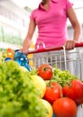 Shopping cart filled with vegetables and fruit Royalty Free Stock Photo