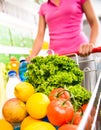 Shopping cart filled with vegetables and fruit Royalty Free Stock Photo