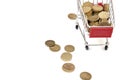 Shopping cart full of coins on white background, shopping Royalty Free Stock Photo