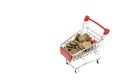 Shopping cart full of coins on white background, shopping Royalty Free Stock Photo