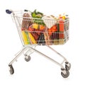 Shopping cart full dairy grocery Royalty Free Stock Photo