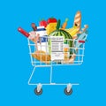 Shopping cart full of groceries and receipt Royalty Free Stock Photo