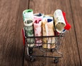 Shopping cart full of money (dollar, euro )