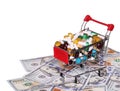 Shopping cart full with pills over dollar bills, isolated