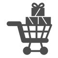 Shopping cart with gift boxes solid icon, shopping concept, trolley full of gifts sign on white background, Supermarket Royalty Free Stock Photo