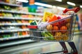 Shopping cart in grocery store full of fruits and vegetables Royalty Free Stock Photo