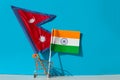 Shopping cart with Indian and Nepalese flags. Royalty Free Stock Photo