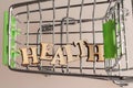 shopping cart with the inscription health lined with letters, the concept of a healthy person