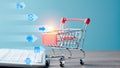 Shopping cart and keyboard on table,Ecommerce concept and online selling website,Retail business with cyberspace technology used