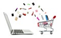 Shopping cart and laptop computer with products isolated Royalty Free Stock Photo