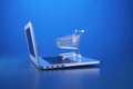 Shopping cart and laptop, online stores concept, blue background. Generative AI Royalty Free Stock Photo