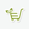 Shopping cart with leaves sticker isolated on white background