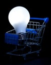 Shopping cart with lightning light bulb Royalty Free Stock Photo