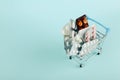 Shopping cart loaded with pills on a blue background. The concept of medicine and the sale of drugs. Copy space Royalty Free Stock Photo