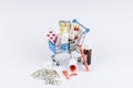 Shopping cart with medicines and moneys on white background