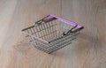 Shopping cart in a minimalist style. Shopping basket at the supermarket. Sale, discount, the concept of shopaholism.