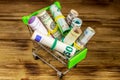 Shopping cart with money from different countries: euros, us dollars, ukrainian hryvnia, russian rubles, egyptian pounds Royalty Free Stock Photo