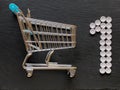 Shopping cart and number one sign made from medical pills, Concept healthcare priority and shopping