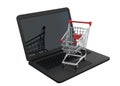 Shopping cart over a laptop computer, isolated on white background Royalty Free Stock Photo