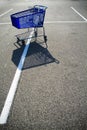 Shopping cart in parking lot Royalty Free Stock Photo