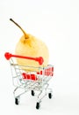 Shopping cart with pear Royalty Free Stock Photo