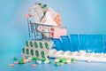 Shopping cart and pills in blisters and plastic container for medicines. Concept of buying medicine online, delivery of Royalty Free Stock Photo