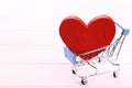 Shopping cart with red heart Royalty Free Stock Photo