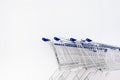 Shopping Cart row on white wall in Retails shop Royalty Free Stock Photo