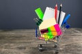 Shopping cart with school supplies. Back to school Royalty Free Stock Photo