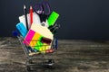 Shopping cart with school supplies. Back to school Royalty Free Stock Photo