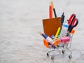 Shopping cart with school supply.