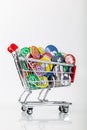 Shopping cart with social media logos from facebook, instagram, youtube and whatsapp symbolizes the business with users