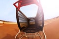 Shopping cart standing at open rooftop parking Royalty Free Stock Photo