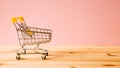 Shopping cart on wooden table