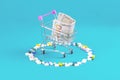 Shopping cart with tablet and dollar banknote. Spending money on pills and expensiveness of medicine concept Royalty Free Stock Photo